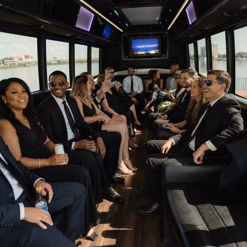 Wedding guests seated inside a Shreveport party bus