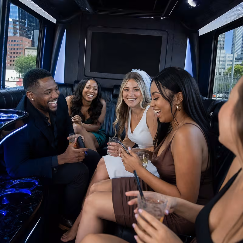 Party bus interior with wraparound leather seating and LED lighting in Shreveport