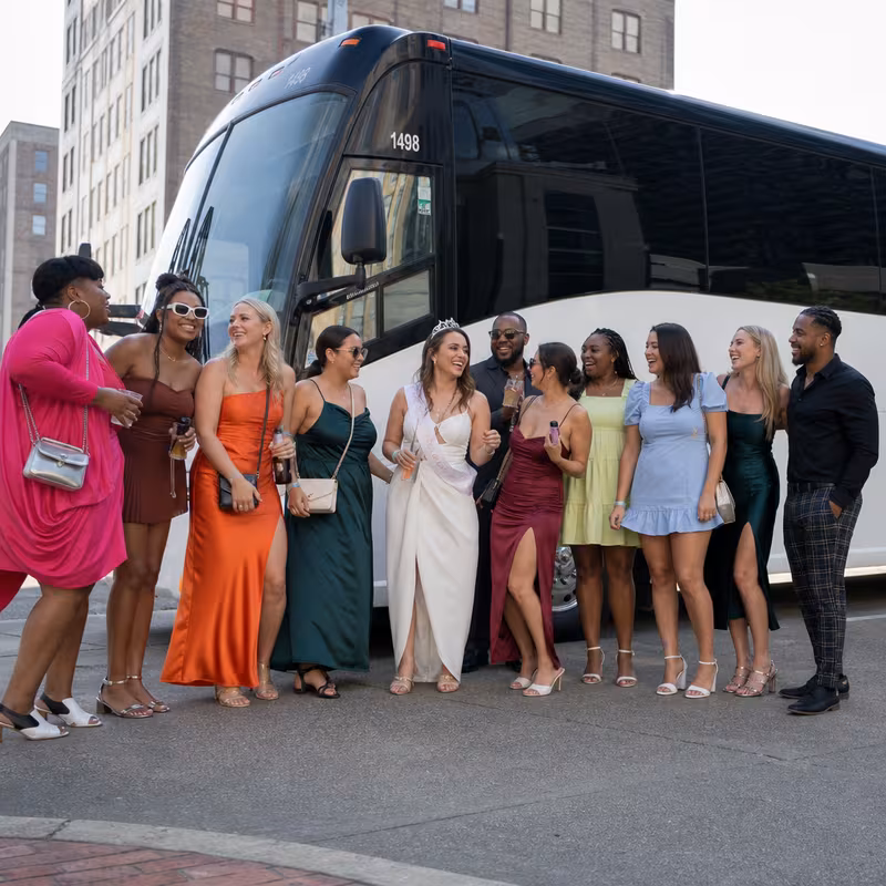 Passengers loading luggage while boarding an Shreveport group shuttle
