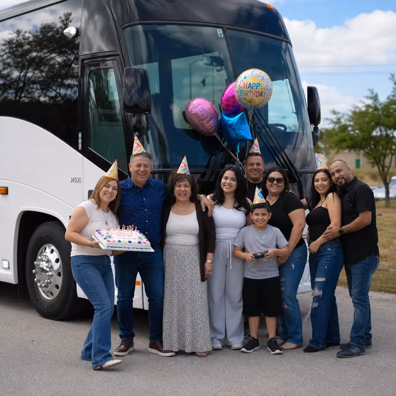 Passengers loading luggage while boarding an Shreveport group shuttle