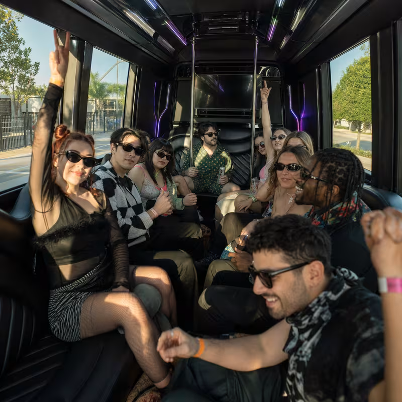 Passengers loading luggage while boarding an Shreveport group shuttle