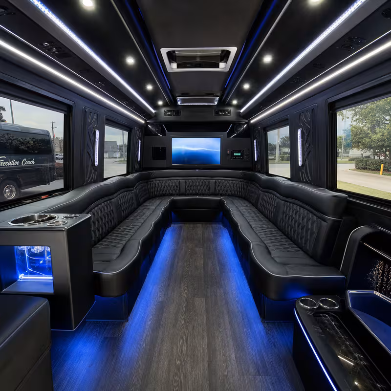 Party bus interior with wraparound leather seating and LED lighting in Shreveport