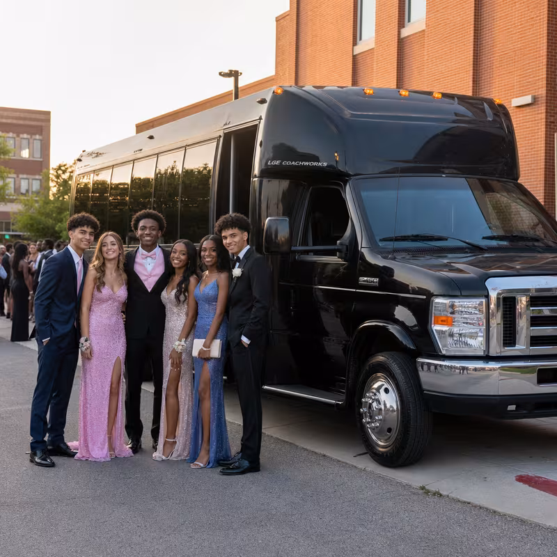 Group boarding a white charter bus for Prom & Homecoming Transportation transportation in Shreveport