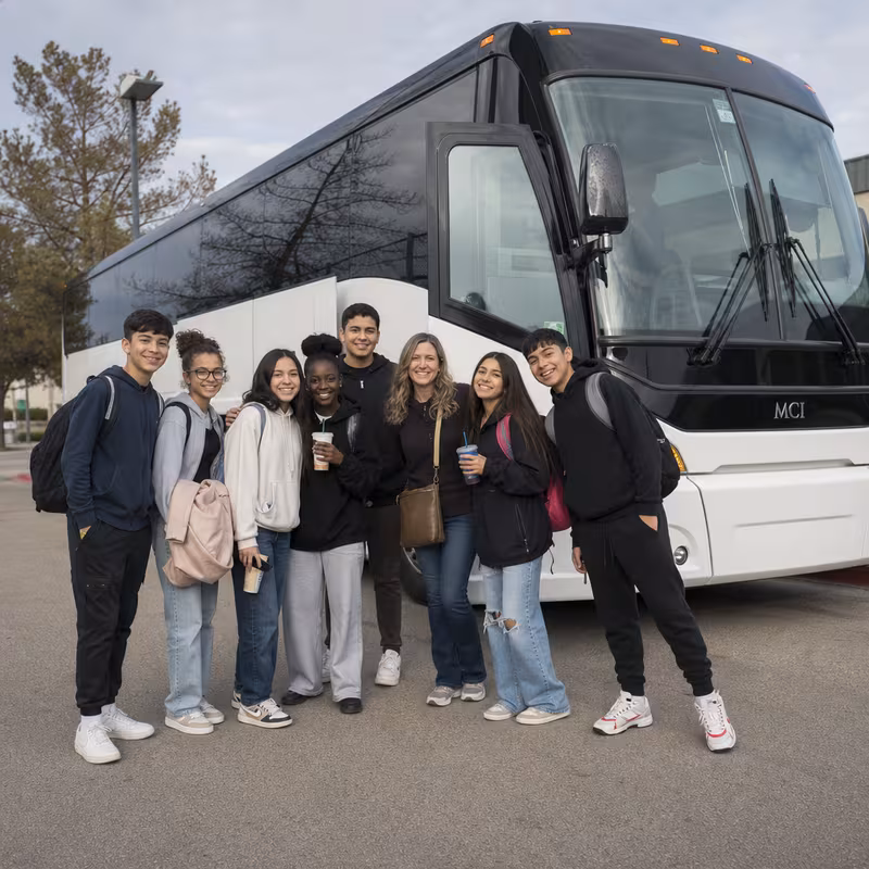 Passengers loading luggage while boarding an Shreveport group shuttle