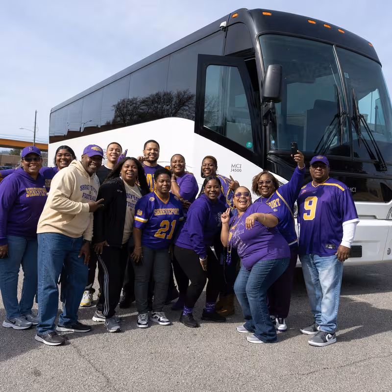 Passengers loading luggage while boarding an Shreveport group shuttle