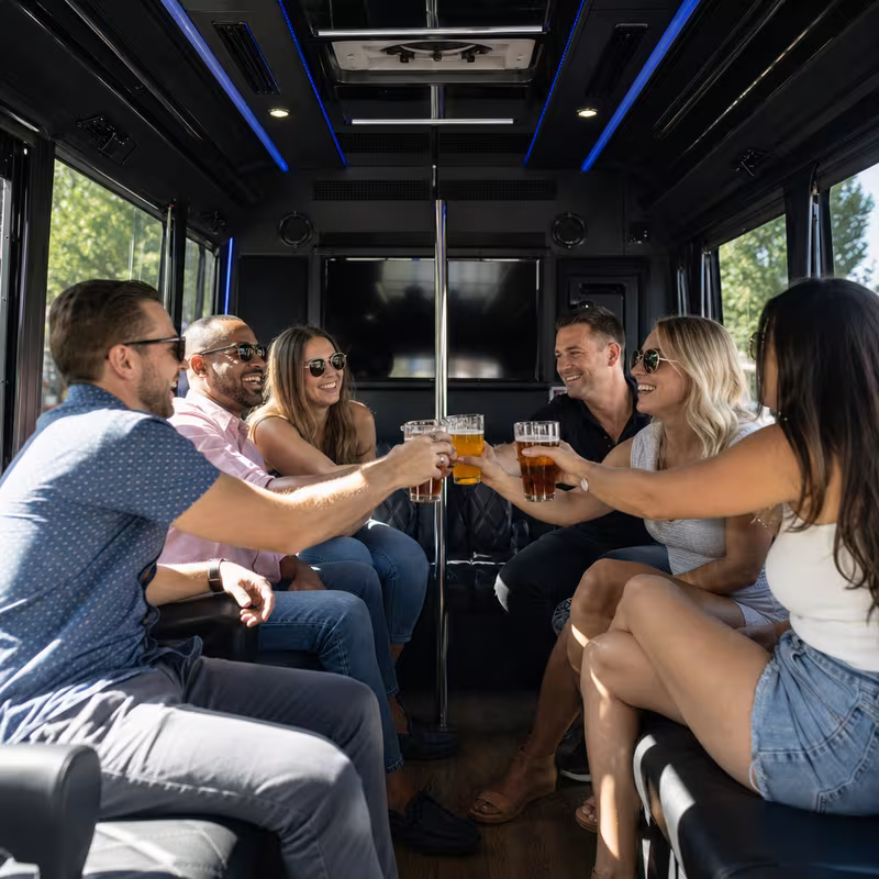 Group boarding a white charter bus for Winery & Brewery Tour Transportation transportation in Shreveport