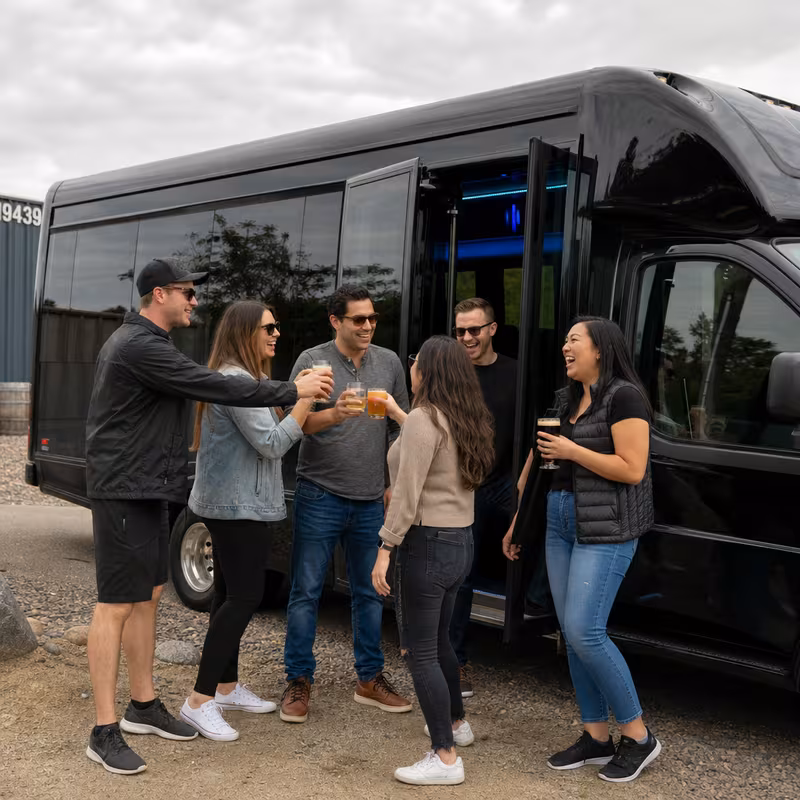 Passengers loading luggage while boarding an Shreveport group shuttle